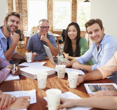 Group Of Office Workers Meeting To Discuss Ideas Mobile Corporate Wellness