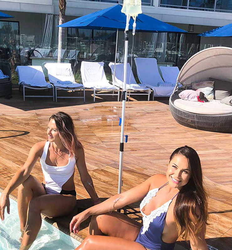 Girls-getting-mobile-IV-therapy-at-hotel-pool-in-Ibiza-Spain Girls-getting-mobile-IV-therapy-at-hotel-pool-in-Ibiza-Spain