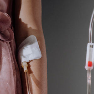 how to insert iv at home Woman with an IV in her hand