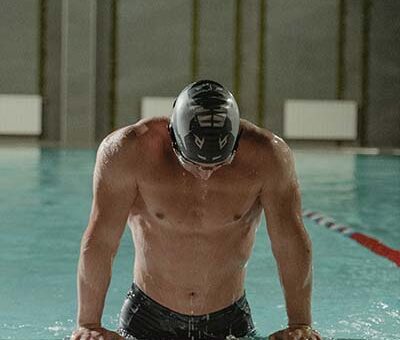 muscle athlete swimmer recovery nad muscular swimmer coming out of the pool