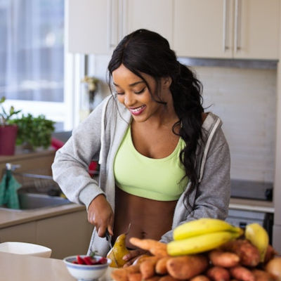 healthy-woman woman preparing healthy food in her kitchen