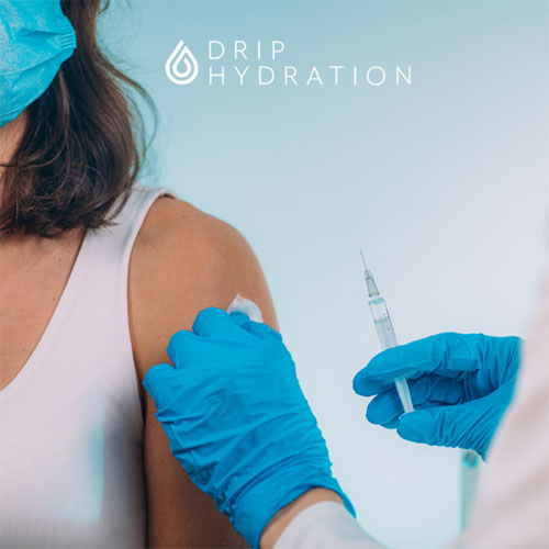 At-Home-Flu-Shots-Drip-Hydration Nurse giving patient a shot