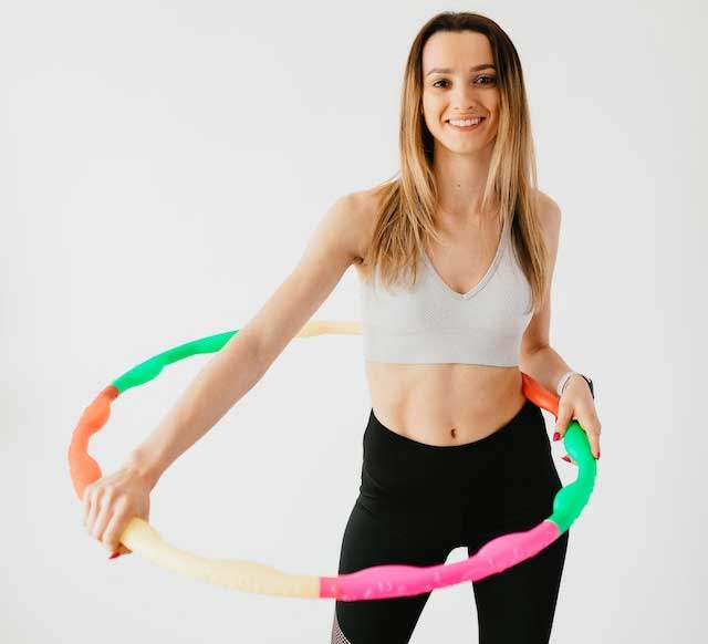 cjc-image1 Woman with a Hula hoop, smiling, happy